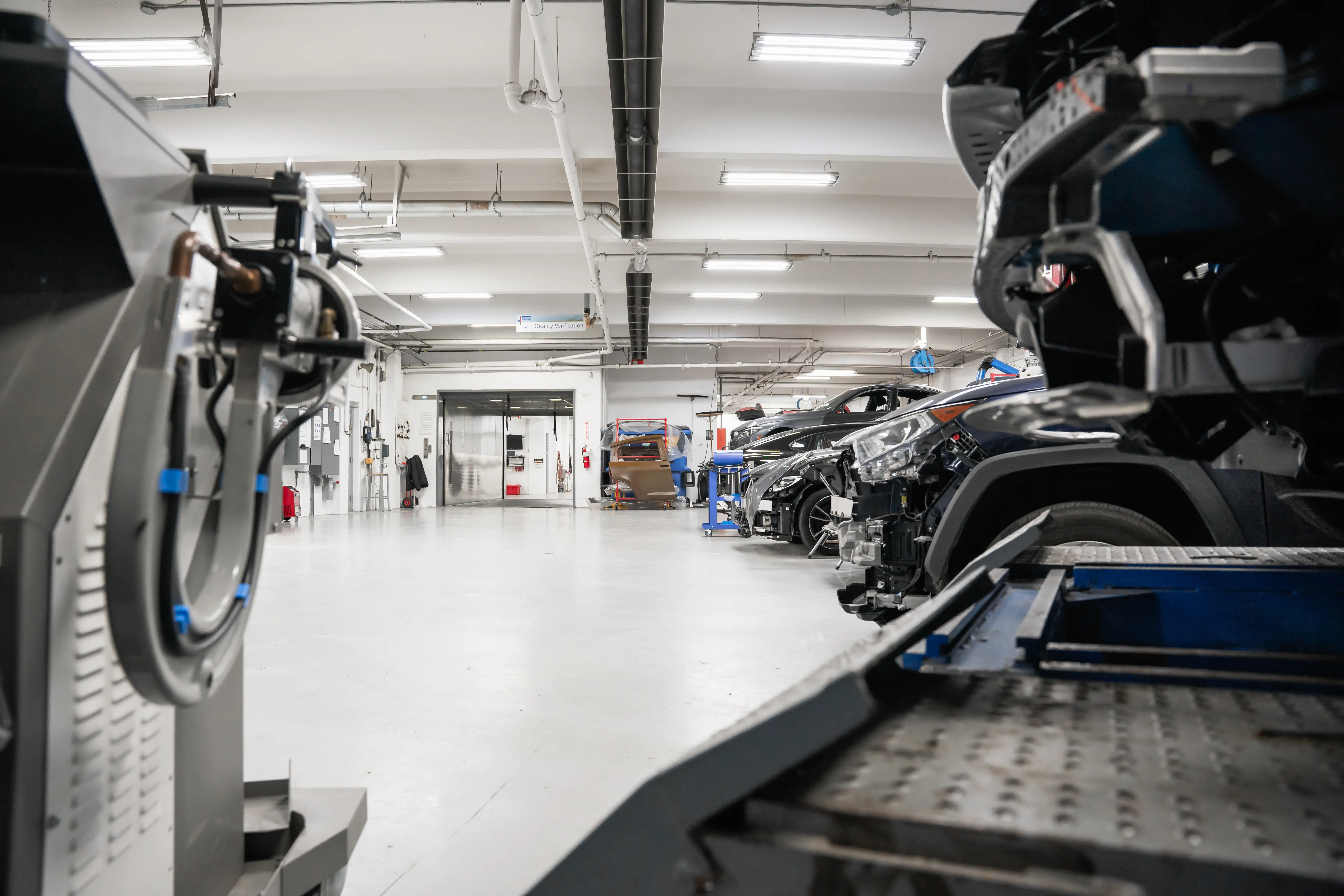Auto body repair technician working on vehicle